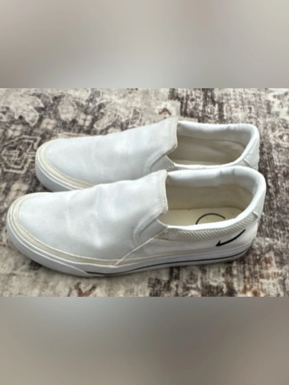 Nike Women’s White Slip-On Sneakers with Black Swoosh Accent